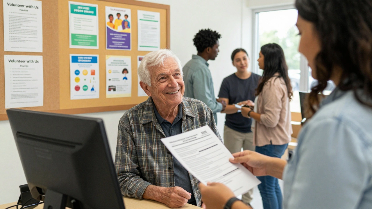A local government employee assisting an elderly resident at a community center kiosk with service forms.